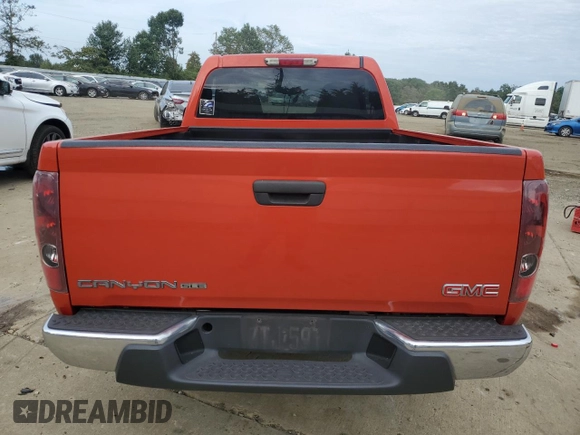 2010 GMC Canyon SLE1 with VIN 1GTCSCDE7A8136742, listed as a Copart auction lot 71637644 with 0 mi miles and Salvage Title. Bid and sale history available at carsss.com. Image 6.