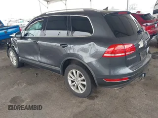 2014 Volkswagen Touareg Sport with VIN WVGEF9BP0ED015273, listed as a IAAI auction lot 42046823 with 84,694 mi miles and . Bid and sale history available at DreamBid. Image 3.