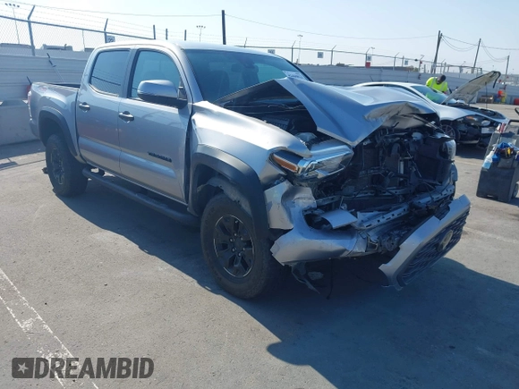 2021 Toyota Tacoma SR with VIN 5TFCZ5AN6MX270972, listed as a IAAI auction lot 42460823 with 76,062 mi miles and . Bid and sale history available at DreamBid. Image 1.
