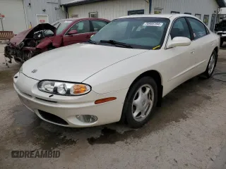 2003 Oldsmobile Aurora z VIN 1G3GS64C834100084, wystawiony jako Copart lot #76966704 z przebiegiem 70 263 mil mil oraz Szkody całkowita. Historia ofert i sprzedaży dostępna na DreamBid. Obrazek 1.