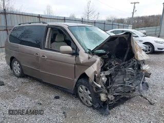 2004 Honda Odyssey EX z VIN 5FNRL18634B004127, wystawiony jako IAAI lot #41854878 z przebiegiem 242 601 mil mil oraz . Historia ofert i sprzedaży dostępna na DreamBid. Obrazek 1.
