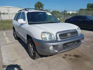 2004 Hyundai Santa Fe GLS with VIN KM8SC73D74U675555, listed as a IAAI auction lot 42021978 with 198,778 mi miles. Bid and sale history available at carsss.com. Image 1.