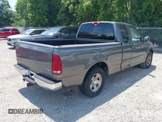 2002 Ford F-150 XL with VIN 1FTRX17W22NA43571, listed as a IAAI auction lot 42697861 with Not provided miles and . Bid and sale history available at DreamBid. Image 4.
