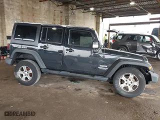 2015 Jeep Wrangler Unlimited Willys Wheeler with VIN 1C4BJWDG9FL652607, listed as a IAAI auction lot 41836193 with 166,152 mi miles. Bid and sale history available at carsss.com. Image 13.