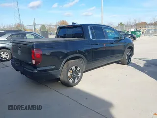 2020 Honda Ridgeline RTL with VIN 5FPYK3F59LB023212, listed as a IAAI auction lot 40704228 with 73,259 mi miles and . Bid and sale history available at DreamBid. Image 4.