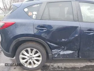 2014 Mazda CX-5 Grand Touring with VIN JM3KE4DY8E0366644, listed as a IAAI auction lot 41971438 with 135,644 mi miles and . Bid and sale history available at carsss.com. Image 6.