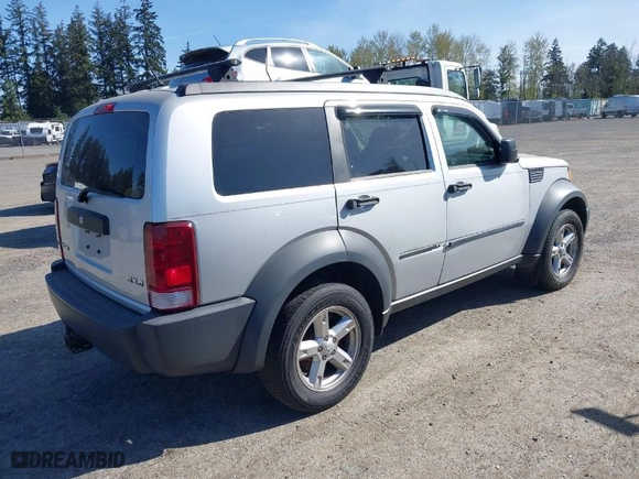 2007 Dodge Nitro SXT with VIN 1D8GU28K87W581969, listed as a IAAI auction lot 42036088 with 128,382 mi miles. Bid and sale history available at carsss.com. Image 4.