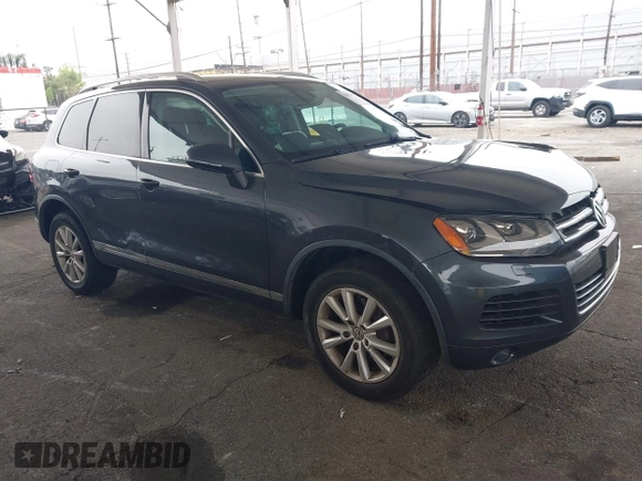 2014 Volkswagen Touareg Sport with VIN WVGEF9BP0ED015273, listed as a IAAI auction lot 42046823 with 84,694 mi miles and . Bid and sale history available at DreamBid. Image 1.