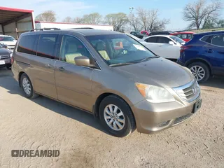 2010 Honda Odyssey EX-L with VIN 5FNRL3H79AB048049, listed as a IAAI auction lot 42055090 with 142,736 mi miles. Bid and sale history available at carsss.com. Image 1.