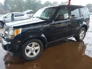 2007 Dodge Nitro SXT with VIN 1D8GT28K67W683600, listed as a IAAI auction lot 40958011 with 70,141 mi miles. Bid and sale history available at carsss.com. Image 2.