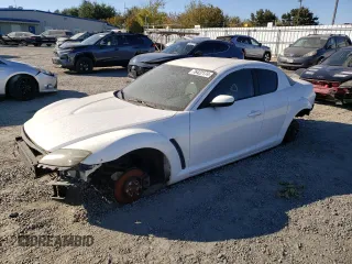 2005 Mazda RX-8 with VIN JM1FE173650147951, listed as a Copart auction lot 76422174 with 0 mi miles and Salvage Title. Bid and sale history available at carsss.com. Image 1.