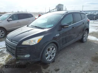 2015 Ford Escape Titanium with VIN 1FMCU0J90FUA32720, listed as a IAAI auction lot 41594336 with 180,250 mi miles. Bid and sale history available at carsss.com. Image 2.