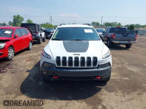 2014 Jeep Cherokee Trailhawk z VIN 1C4PJMBS0EW188976, wystawiony jako IAAI lot #42587233 z przebiegiem 191 670 mil mil oraz . Historia ofert i sprzedaży dostępna na DreamBid. Obrazek 12.