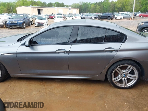 2016 BMW 6 Series 640i xDrive with VIN WBA6D2C58GGT66160, listed as a IAAI auction lot 41130666 with 102,064 mi miles and . Bid and sale history available at carsss.com. Image 15.