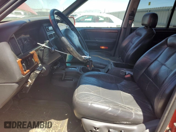 1997 Jeep Grand Cherokee Limited with VIN 1J4GZ78Y7VC573971, listed as a Copart auction lot 61358024 with 171,055 mi miles and Salvage Title. Bid and sale history available at carsss.com. Image 7.