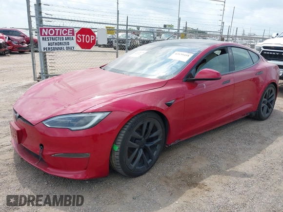 2022 Tesla Model S with VIN 5YJSA1E58NF486727, listed as a IAAI auction lot 42139418 with Not provided miles and . Bid and sale history available at DreamBid. Image 2.