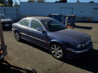 2004 Jaguar X-Type with VIN SAJEA51C04WD74995, listed as a Copart auction lot 77216404 with 87,853 mi miles and Clean Title. Bid and sale history available at carsss.com. Image 4.