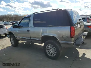 1999 Chevrolet Tahoe with VIN 3GNEK18R9XG152347, listed as a Copart auction lot 80785154 with 301,018 mi miles and Salvage Title. Bid and sale history available at carsss.com. Image 2.