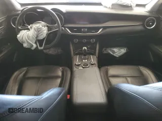 2018 Alfa Romeo Stelvio Ti z VIN ZASFAKBNXJ7B80163, wystawiony jako Copart lot #41805085 z przebiegiem Nie podano mil oraz Szkody całkowita. Historia ofert i sprzedaży dostępna na DreamBid. Obrazek 8.