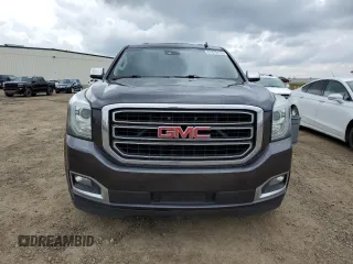 2015 GMC Yukon SLT z VIN 1GKS2BKCXFR269881, wystawiony jako Copart lot #57678175 z przebiegiem 256 703 mil mil oraz Czysty tytuł • Clean title. Historia ofert i sprzedaży dostępna na DreamBid. Obrazek 5.