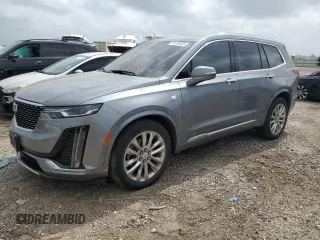 2021 Cadillac XT6 Premium Luxury z VIN 1GYKPCRS5MZ173938, wystawiony jako Copart lot #51763435 z przebiegiem 75 247 mil mil oraz Tytuł czysty. Historia ofert i sprzedaży dostępna na DreamBid. Obrazek 1.