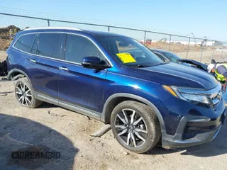 2019 Honda Pilot Touring 7-Passenger z VIN 5FNYF5H69KB035874, wystawiony jako IAAI lot #41785766 z przebiegiem 83 726 mil mil oraz . Historia ofert i sprzedaży dostępna na DreamBid. Obrazek 1.