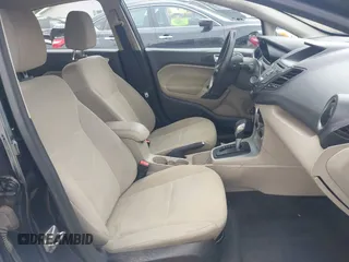 2016 Ford Fiesta SE z VIN 3FADP4EJXGM154072, wystawiony jako IAAI lot #42366219 z przebiegiem 155 506 mil mil oraz . Historia ofert i sprzedaży dostępna na DreamBid. Obrazek 5.