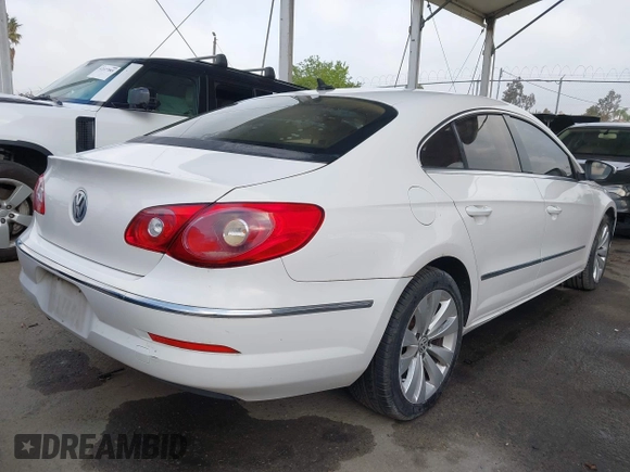 2009 Volkswagen CC Sport with VIN WVWML73C79E566020, listed as a IAAI auction lot 42140306 with 133,411 mi miles. Bid and sale history available at carsss.com. Image 4.