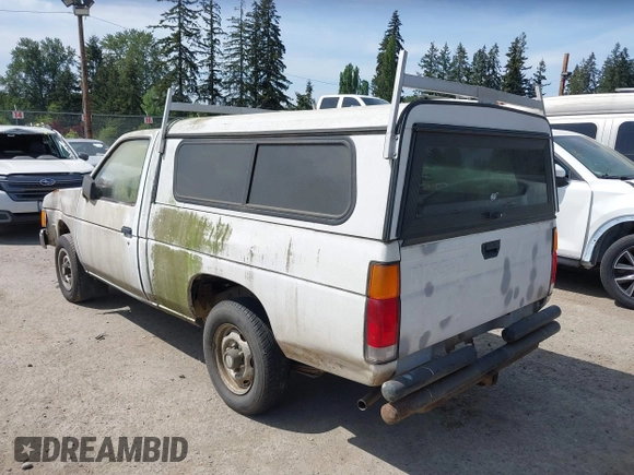 1987 Nissan Hardbody E z VIN JN6ND11S1HW047821, wystawiony jako IAAI lot #42210912 z przebiegiem 162 721 mil mil oraz . Historia ofert i sprzedaży dostępna na DreamBid. Obrazek 3.