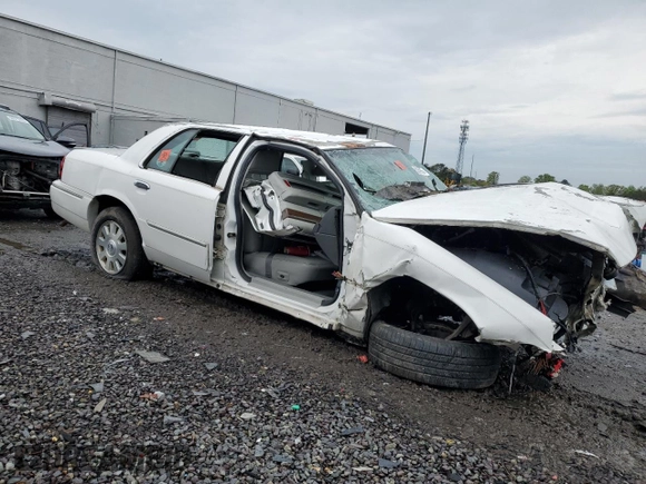 2003 Mercury Grand Marquis LS Premium with VIN 2MEFM75W13X667779, listed as a Copart auction lot 52869985 with 127,506 mi miles and Salvage Title. Bid and sale history available at DreamBid. Image 4.