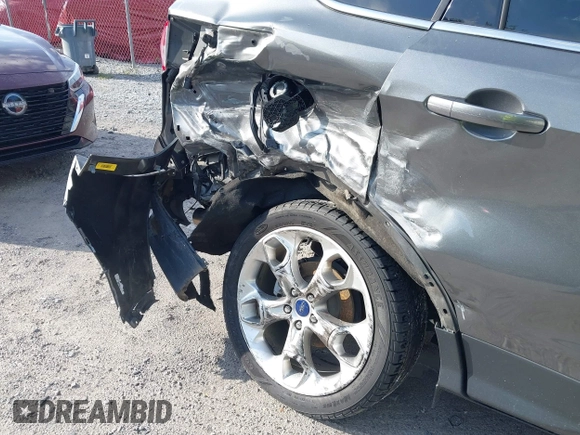 2013 Ford Escape Titanium with VIN 1FMCU0J96DUC31879, listed as a IAAI auction lot 42637019 with 66,096 mi miles and . Bid and sale history available at DreamBid. Image 6.
