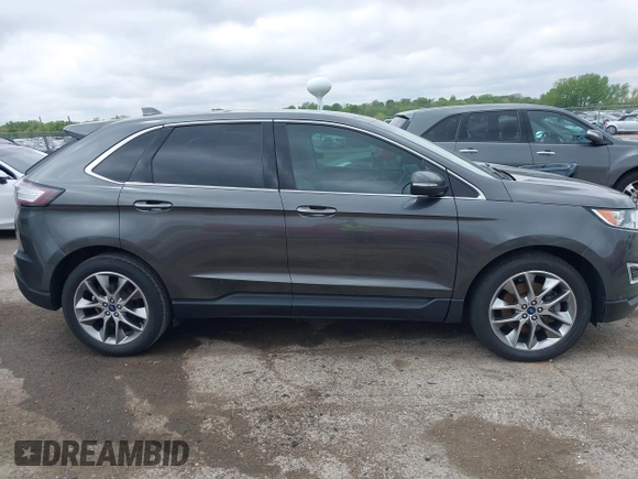 2015 Ford Edge Titanium z VIN 2FMTK3K81FBB88882, wystawiony jako IAAI lot #42184698 z przebiegiem 161 858 mil mil oraz . Historia ofert i sprzedaży dostępna na DreamBid. Obrazek 13.