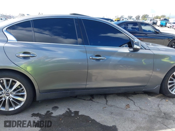 2019 Infiniti Q50 Luxe z VIN JN1EV7APXKM512617, wystawiony jako IAAI lot #41517907 z przebiegiem 46 619 mil mil oraz . Historia ofert i sprzedaży dostępna na DreamBid. Obrazek 13.