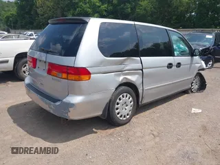 2004 Honda Odyssey LX with VIN 5FNRL18504B129349, listed as a IAAI auction lot 42393492 with 243,232 mi miles and . Bid and sale history available at DreamBid. Image 4.