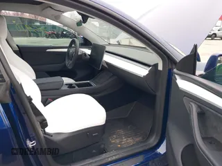 2024 Tesla Model Y Long Range with VIN 7SAYGDEE9RA269882, listed as a IAAI auction lot 41771485 with 18,145 mi miles. Bid and sale history available at carsss.com. Image 5.