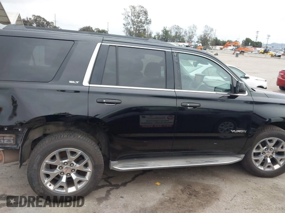 2015 GMC Yukon SLT with VIN 1GKS1BKC3FR129173, listed as a IAAI auction lot 41795585 with 97,893 mi miles. Bid and sale history available at carsss.com. Image 14.