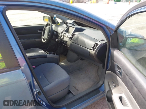 2007 Toyota Prius z VIN JTDKB20U677595987, wystawiony jako IAAI lot #41876974 z przebiegiem 218 650 mil mil oraz . Historia ofert i sprzedaży dostępna na DreamBid. Obrazek 5.