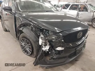2020 Mazda CX-5 Touring with VIN JM3KFBCM9L1785125, listed as a IAAI auction lot 41983561 with 101,062 mi miles and . Bid and sale history available at carsss.com. Image 6.