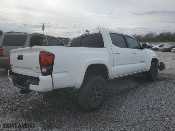 2023 Toyota Tacoma 4WD SR with VIN 3TMCZ5AN2PM593958, listed as a Copart auction lot 84627294 with 18,928 mi miles and Salvage Title. Bid and sale history available at carsss.com. Image 3.
