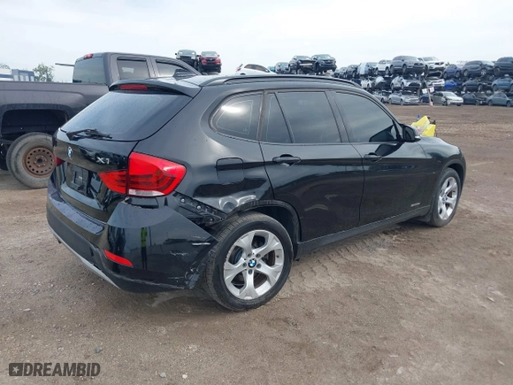 2014 BMW X1 sDrive28i with VIN WBAVM1C54EVW46561, listed as a IAAI auction lot 41880387 with 125,096 mi miles. Bid and sale history available at carsss.com. Image 4.