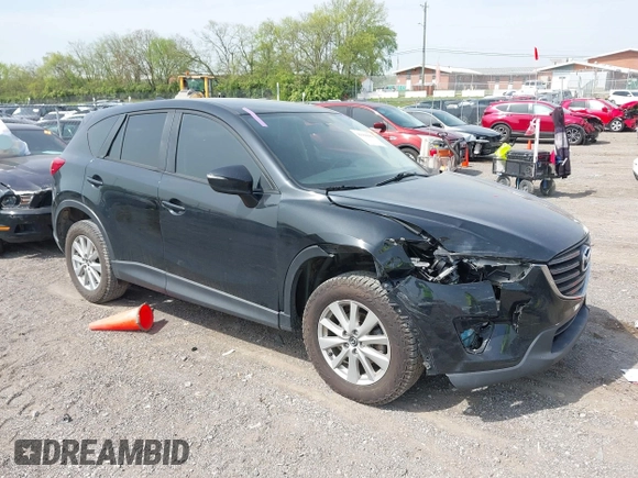 2016 Mazda CX-5 Sport with VIN JM3KE4BY8G0746377, listed as a IAAI auction lot 41990988 with 144,558 mi miles and . Bid and sale history available at carsss.com. Image 1.