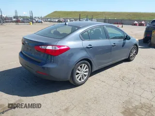 2015 Kia Forte LX with VIN KNAFX4A61F5354649, listed as a IAAI auction lot 42040586 with 113,436 mi miles. Bid and sale history available at carsss.com. Image 4.
