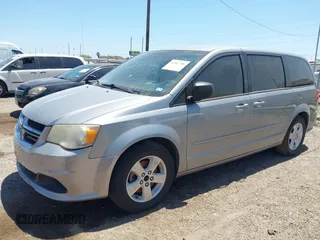 2013 Dodge Grand Caravan SE with VIN 2C4RDGBG0DR702913, listed as a IAAI auction lot 42007786 with 163,981 mi miles and . Bid and sale history available at DreamBid. Image 2.