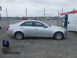 2014 Cadillac CTS Luxury AWD z VIN 1G6AX5SX2E0196881, wystawiony jako IAAI lot #41707633 z przebiegiem 169 168 mil mil oraz . Historia ofert i sprzedaży dostępna na DreamBid. Obrazek 13.