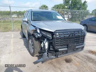 2025 Hyundai Palisade SEL z VIN KM8R2DGE2SU842064, wystawiony jako IAAI lot #42219424 z przebiegiem 13 615 mil mil oraz . Historia ofert i sprzedaży dostępna na DreamBid. Obrazek 1.