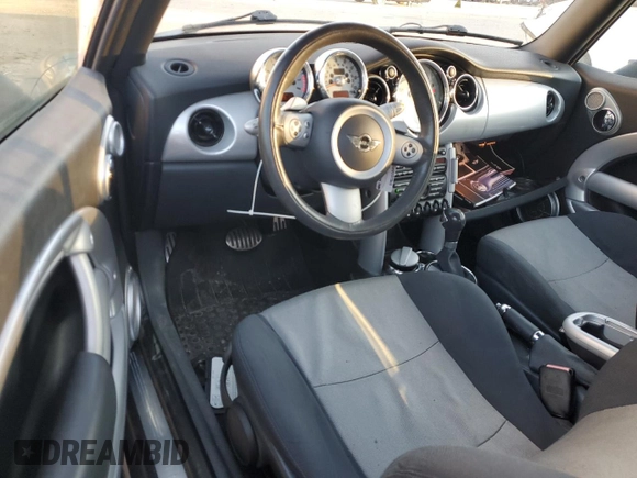 2006 MINI Convertible S with VIN WMWRH33526TL93206, listed as a Copart auction lot 46114075 with 60,526 mi miles and Salvage title. Bid and sale history available at DreamBid. Image 8.
