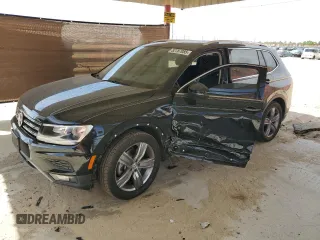 2020 Volkswagen Tiguan SE z VIN 3VV3B7AXXLM138188, wystawiony jako Copart lot #52787085 z przebiegiem 58 363 mil mil oraz Szkody całkowita. Historia ofert i sprzedaży dostępna na DreamBid. Obrazek 1.
