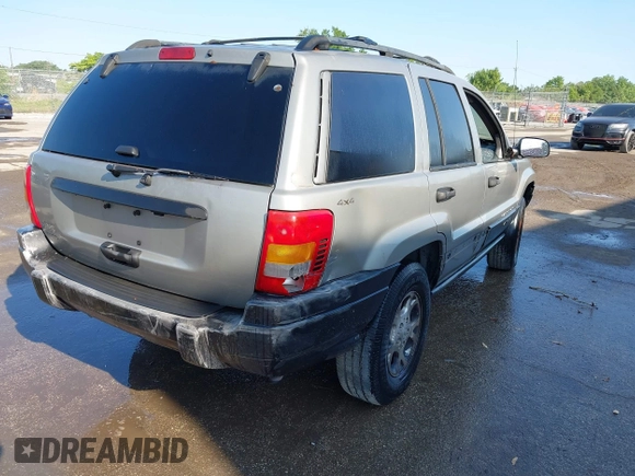 2000 Jeep Grand Cherokee Laredo z VIN 1J4GW48S8YC244168, wystawiony jako IAAI lot #41907447 z przebiegiem 243 154 mil mil oraz . Historia ofert i sprzedaży dostępna na DreamBid. Obrazek 4.