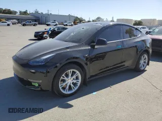 2023 Tesla Model Y Long Range z VIN 7SAYGDEE2PF792886, wystawiony jako Copart lot #56055205 z przebiegiem 54 138 mil mil oraz Szkoda całkowita • Salvage title. Historia ofert i sprzedaży dostępna na DreamBid. Obrazek 1.