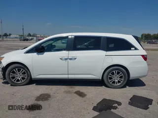 2012 Honda Odyssey EX-L with VIN 5FNRL5H61CB019215, listed as a IAAI auction lot 41837320 with 248,498 mi miles and . Bid and sale history available at DreamBid. Image 15.